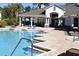 Community pool with inviting blue water and a luxurious clubhouse at 4340 S Kirkman Rd # 905, Orlando, FL 32811