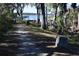 Scenic walking trail through the woods with a lake view at 4340 S Kirkman Rd # 905, Orlando, FL 32811
