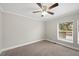 Spacious bedroom with ceiling fan and large window at 3046 Crystal Hills Dr, Lakeland, FL 33801