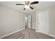 Bedroom with carpet, ceiling fan, and ample closet space at 3046 Crystal Hills Dr, Lakeland, FL 33801