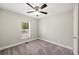 Bright bedroom with carpet, ceiling fan, and window at 3046 Crystal Hills Dr, Lakeland, FL 33801