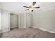 Bedroom with ceiling fan and double door closet at 3046 Crystal Hills Dr, Lakeland, FL 33801