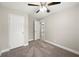 Bedroom with carpet, ceiling fan, and ample closet space at 3046 Crystal Hills Dr, Lakeland, FL 33801