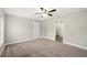 Bright bedroom with ceiling fan and access to a bathroom at 3046 Crystal Hills Dr, Lakeland, FL 33801