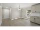Bright dining area with vinyl flooring and kitchen access at 3046 Crystal Hills Dr, Lakeland, FL 33801