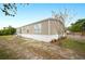 Tan mobile home with landscaping and spacious yard at 3046 Crystal Hills Dr, Lakeland, FL 33801