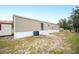 Tan mobile home with landscaping and spacious yard at 3046 Crystal Hills Dr, Lakeland, FL 33801