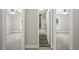 Hallway view of two bedrooms and a bath with updated finishes at 3046 Crystal Hills Dr, Lakeland, FL 33801