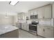 Modern kitchen with stainless steel appliances and granite countertops at 3046 Crystal Hills Dr, Lakeland, FL 33801