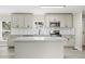 Modern kitchen with white cabinets, granite counters, and stainless appliances at 3046 Crystal Hills Dr, Lakeland, FL 33801