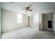 Spacious bedroom with ceiling fan and walk-in closet at 5325 Charlin Ave, Lakeland, FL 33810