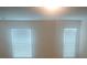 This bedroom has two bright windows that let in plenty of light at 745 Marsh Reed Dr, Winter Garden, FL 34787