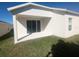 Large covered back patio sliding glass door to the backyard for easy access at 478 Disa Dr, Davenport, FL 33837