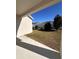Fenced backyard with covered patio and grassy area at 478 Disa Dr, Davenport, FL 33837
