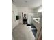 Bright bathroom with granite countertops, shower, and tile flooring at 478 Disa Dr, Davenport, FL 33837