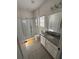 Clean bathroom with granite vanity and shower at 478 Disa Dr, Davenport, FL 33837