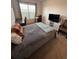 Comfortable bedroom with a double bed and window seating at 478 Disa Dr, Davenport, FL 33837