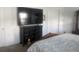 Well-furnished bedroom featuring a large TV mounted above a dark wood dresser at 478 Disa Dr, Davenport, FL 33837