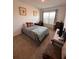 Cozy bedroom with a double bed, desk, and window at 478 Disa Dr, Davenport, FL 33837