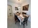 Dining area with a table set for six, autumn decor, and chandelier at 478 Disa Dr, Davenport, FL 33837
