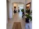 Light-filled entryway featuring tile floors and access to other rooms at 478 Disa Dr, Davenport, FL 33837