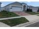 Charming single Gathering home with a two-car garage and manicured front yard at 478 Disa Dr, Davenport, FL 33837