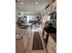 Open concept kitchen with island and view into living room at 478 Disa Dr, Davenport, FL 33837