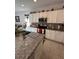 Modern kitchen featuring white cabinets and granite countertops at 478 Disa Dr, Davenport, FL 33837