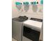Laundry room with washer, dryer, and shelving for storage at 478 Disa Dr, Davenport, FL 33837