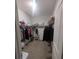 Spacious walk-in closet offering abundant storage with shelving and hanging rods at 478 Disa Dr, Davenport, FL 33837