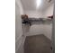 Carpeted walk-in closet with shelving for clothing and accessories at 478 Disa Dr, Davenport, FL 33837