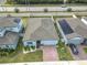 Aerial view of house, driveway and solar panels at 3052 Cassidy Ln, Haines City, FL 33844