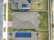 Aerial view showcasing home with solar panels and backyard at 3052 Cassidy Ln, Haines City, FL 33844