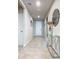 Bright entryway with tile floors and a modern console table at 3052 Cassidy Ln, Haines City, FL 33844