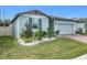 House exterior with landscaping, and a gray color scheme at 3052 Cassidy Ln, Haines City, FL 33844