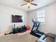 Home gym with treadmill, weights, and TV at 3052 Cassidy Ln, Haines City, FL 33844