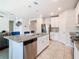 Modern kitchen with island, granite countertops, and stainless steel appliances at 3052 Cassidy Ln, Haines City, FL 33844