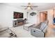 Spacious living room with comfortable seating and an electric fireplace at 3052 Cassidy Ln, Haines City, FL 33844