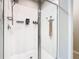 Walk-in shower with glass enclosure and tiled walls at 3052 Cassidy Ln, Haines City, FL 33844
