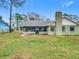 House exterior with a screened porch and grassy backyard at 2226 Baker Ave, Orlando, FL 32833