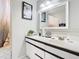 Well-lit bathroom with a vanity and large mirror at 2226 Baker Ave, Orlando, FL 32833