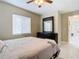 Bright bedroom with a dresser and a comfortable bed at 2226 Baker Ave, Orlando, FL 32833