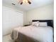 Bedroom with a queen bed, nightstand and double door closet at 2226 Baker Ave, Orlando, FL 32833