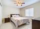 Well-lit bedroom featuring a queen-size bed and nightstand at 2226 Baker Ave, Orlando, FL 32833