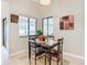 Cozy dining area with wood table and four chairs, near kitchen at 2226 Baker Ave, Orlando, FL 32833