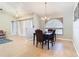 Dining room with hardwood floors, a chandelier, and an arched window at 2226 Baker Ave, Orlando, FL 32833
