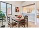 Dining area with table and chairs; open design to kitchen at 2226 Baker Ave, Orlando, FL 32833