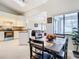 Open kitchen with island, granite counters, and view of living room at 2226 Baker Ave, Orlando, FL 32833