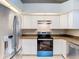 Modern kitchen with stainless steel appliances and granite countertops at 2226 Baker Ave, Orlando, FL 32833