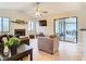 Living room features vaulted ceiling, fireplace, and access to a screened patio at 2226 Baker Ave, Orlando, FL 32833